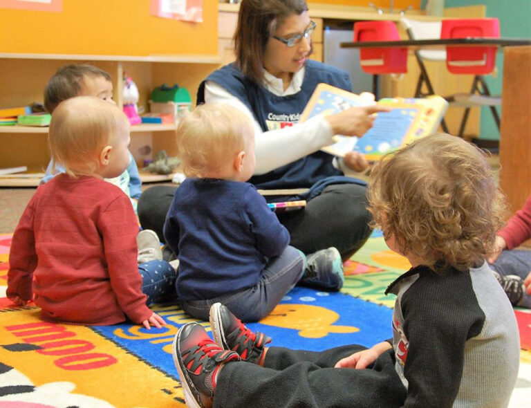 teacher-reading-to-toddlers-in-class-at-a-Preschool-Daycare-Serving-San-Antonio-TX
